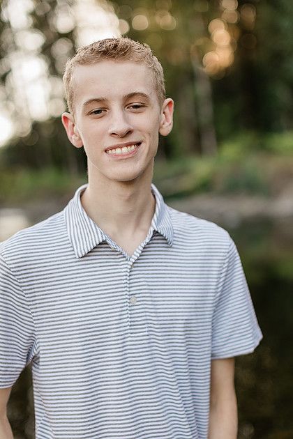 Senior boy by a river in Vancouver, WA