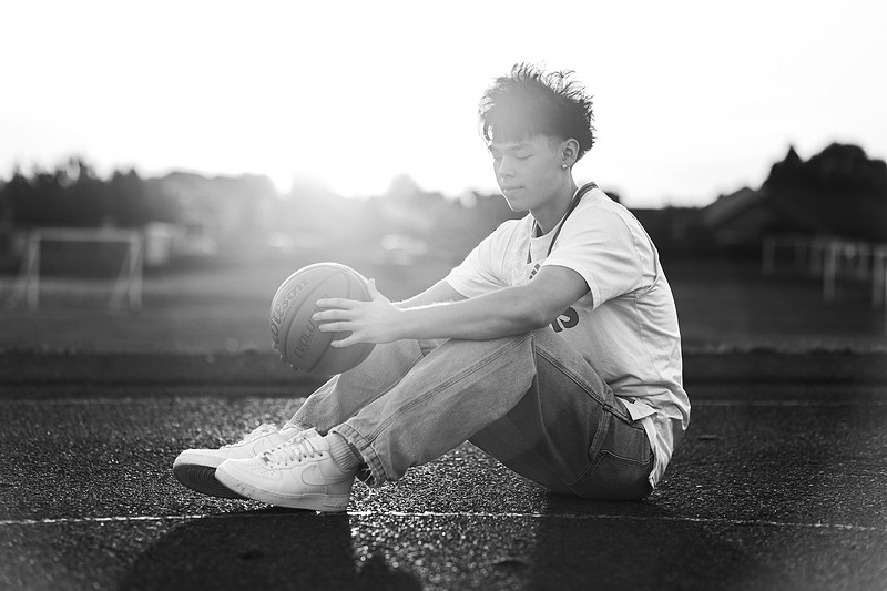Senior boy on the basketball court
