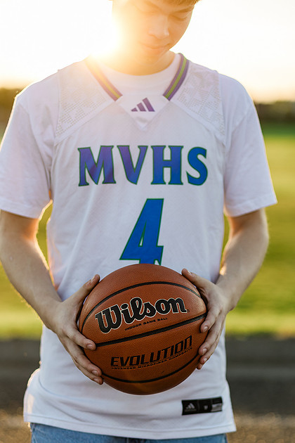 Senior boy on the basketball court