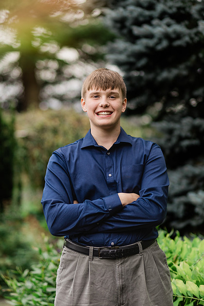 senior boy in a field and garden