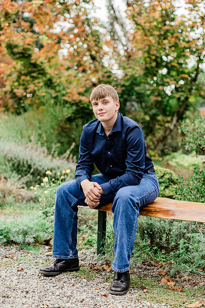 senior boy in a field and garden
