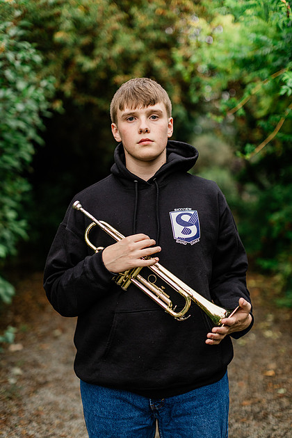 senior boy in a field and garden