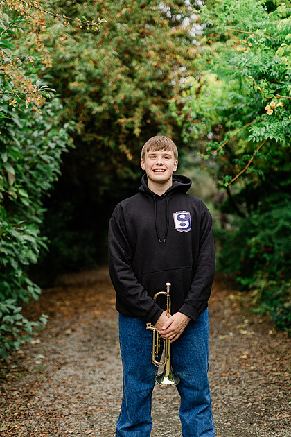senior boy in a field and garden
