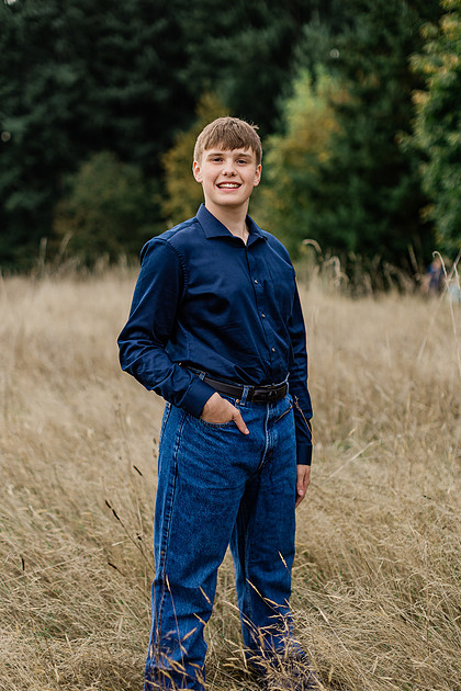 senior boy in a field and garden