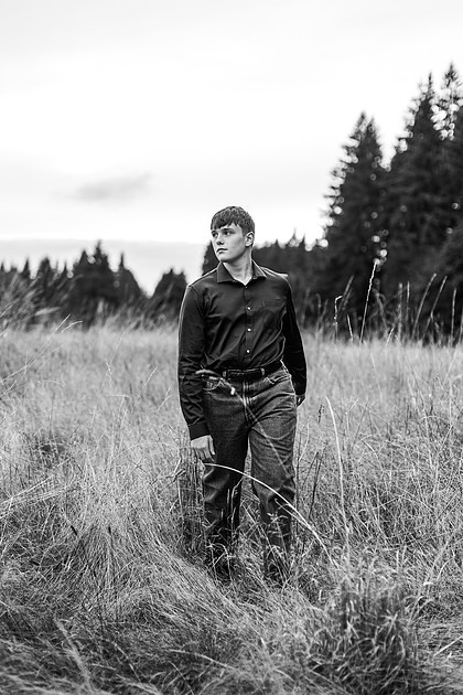 senior boy in a field and garden