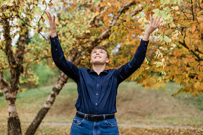 senior boy in a field and garden