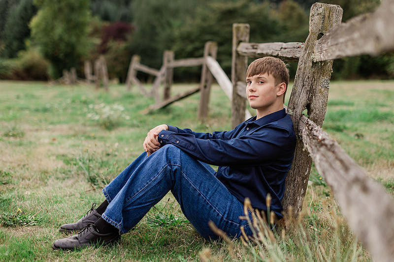 senior boy in a field and garden