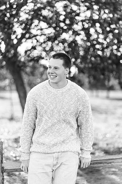 Senior boy portraits by the river and in a field