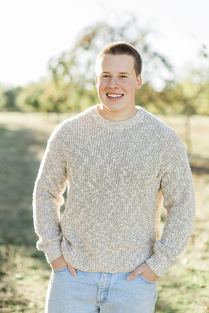 Senior boy portraits by the river and in a field