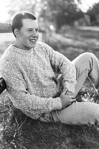 Senior boy portraits by the river and in a field
