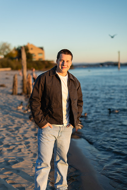 Senior boy portraits by the river and in a field