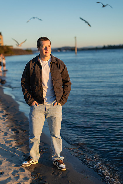 Senior boy portraits by the river and in a field
