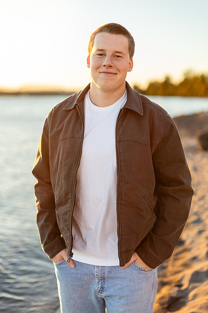 Senior boy portraits by the river and in a field