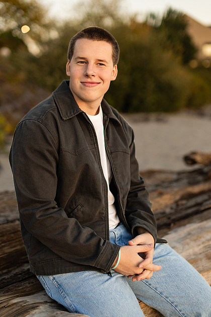Senior boy portraits by the river and in a field