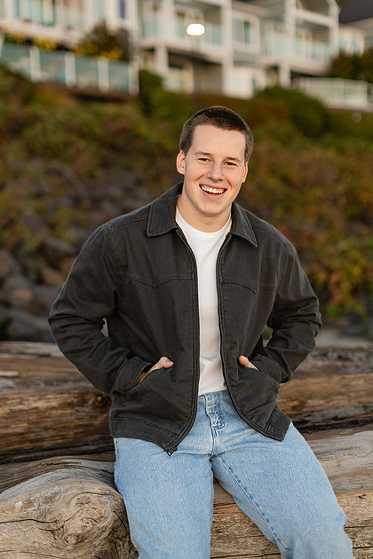 Senior boy portraits by the river and in a field