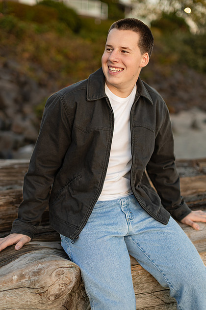 Senior boy portraits by the river and in a field