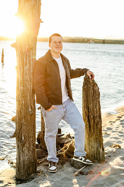 Senior boy portraits by the river and in a field