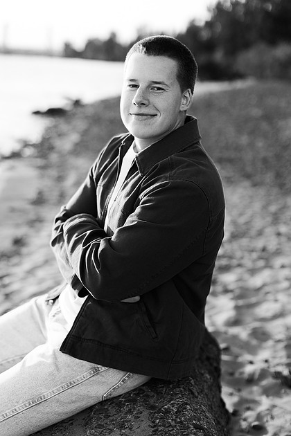 Senior boy portraits by the river and in a field