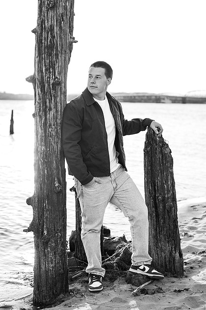 Senior boy portraits by the river and in a field