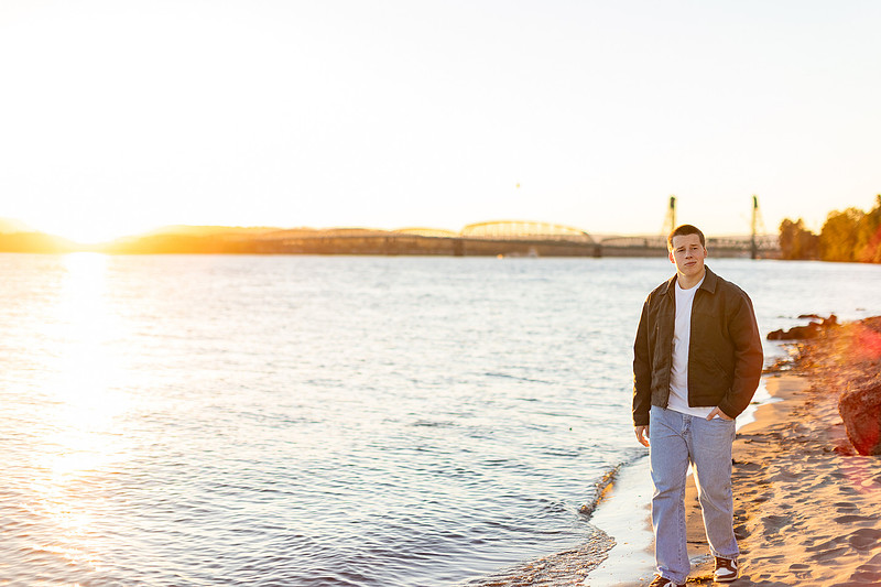 Senior boy portraits by the river and in a field