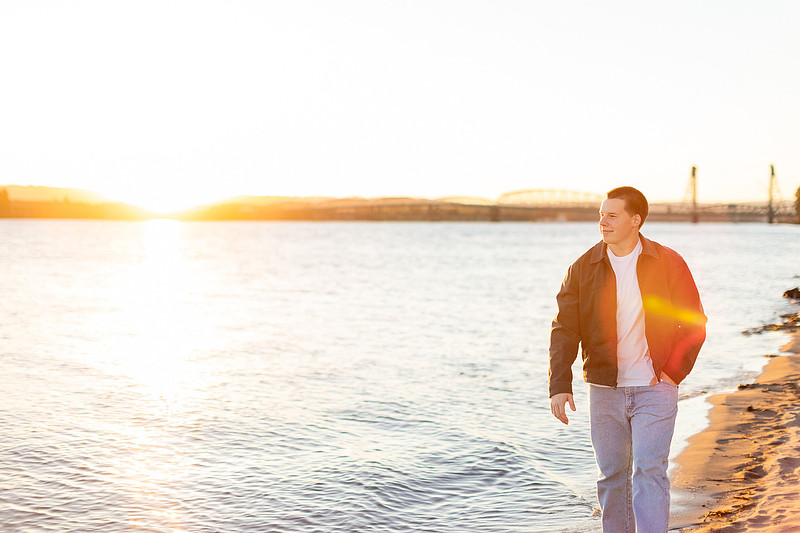 Senior boy portraits by the river and in a field