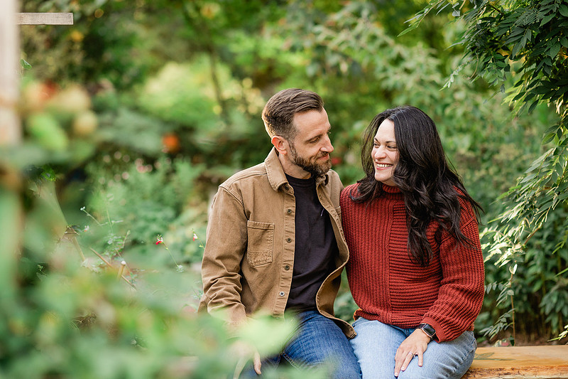 Family of 4 with teens in a garden during the fall season