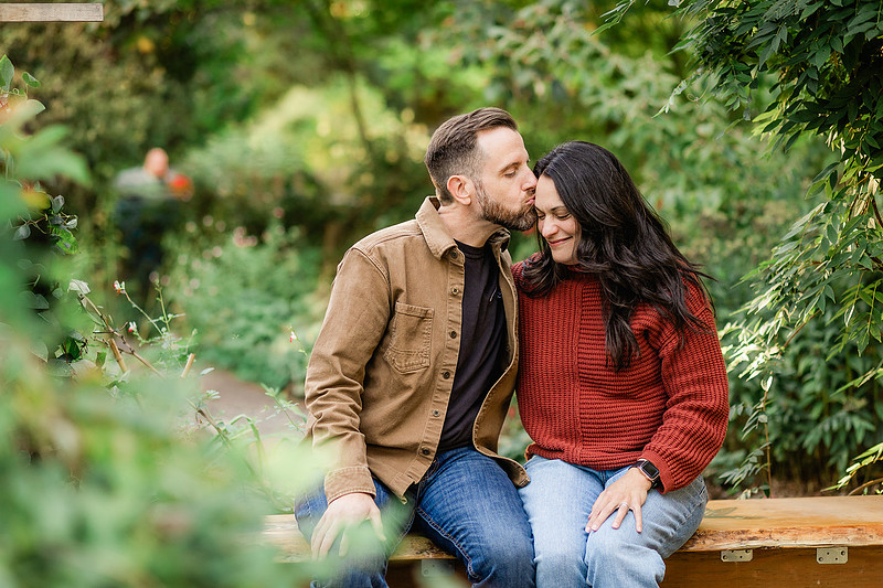 Family of 4 with teens in a garden during the fall season