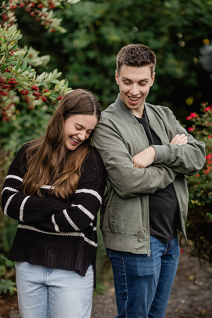 Family of 4 with teens in a garden during the fall season