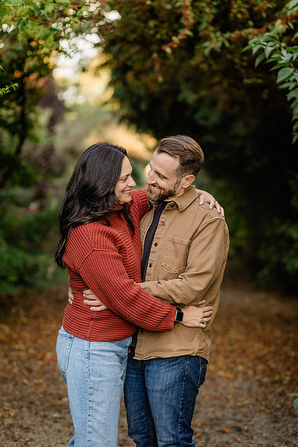 Family of 4 with teens in a garden during the fall season
