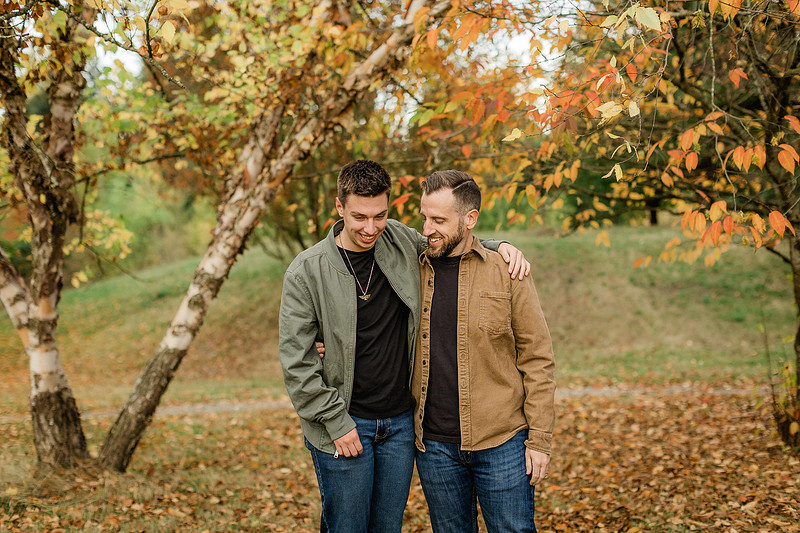 Family of 4 with teens in a garden during the fall season