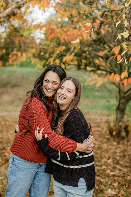 Family of 4 with teens in a garden during the fall season