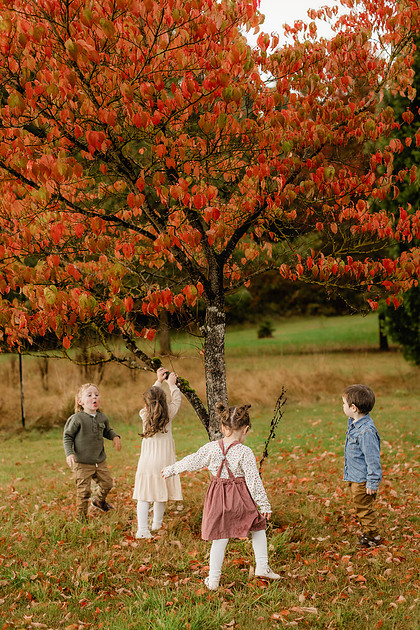 Grown friends and little friends in the fall