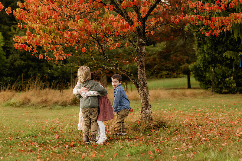 Grown friends and little friends in the fall