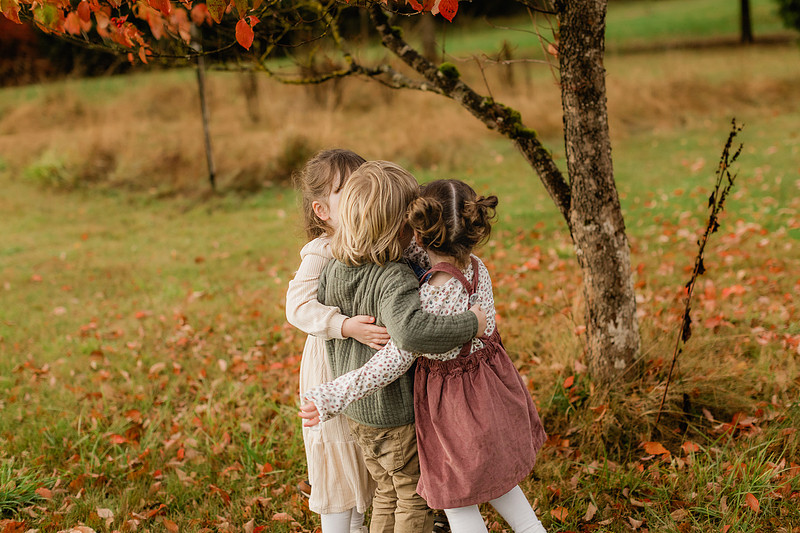 Grown friends and little friends in the fall
