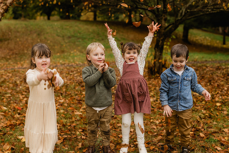 Grown friends and little friends in the fall