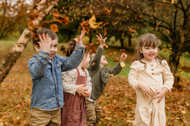 Grown friends and little friends in the fall
