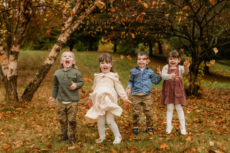 Grown friends and little friends in the fall