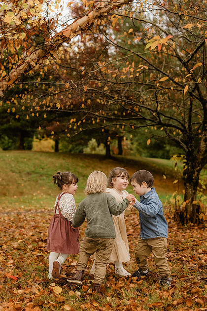 Grown friends and little friends in the fall