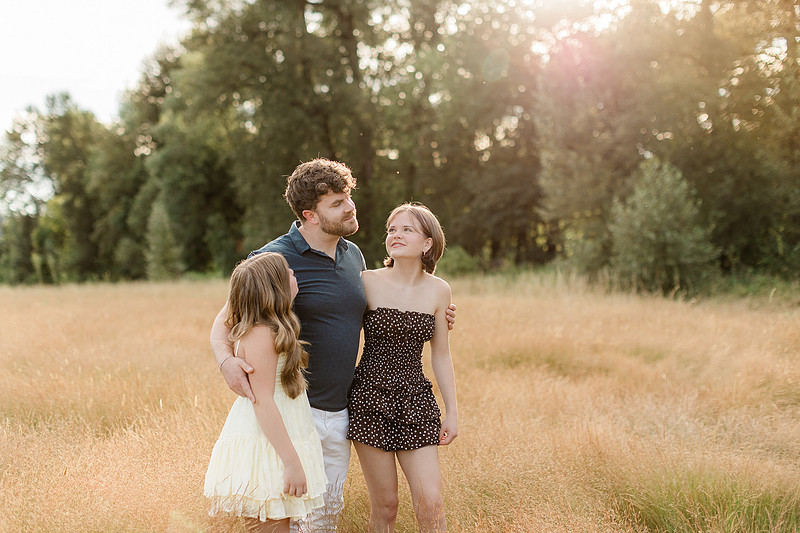 Portrait of a Family of 4 standing in a field at Daybreak Park in Battleground WA