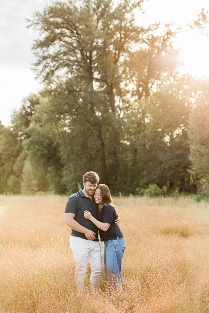 Portrait of a Family of 4 standing in a field at Daybreak Park in Battleground WA