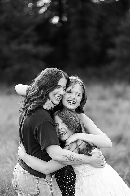Portrait of a Family of 4 standing in a field at Daybreak Park in Battleground WA