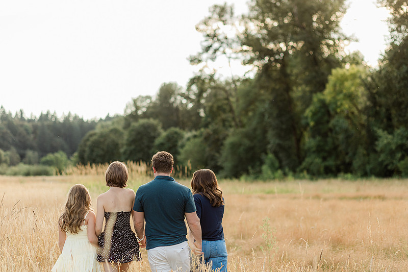 Portrait of a Family of 4 standing in a field at Daybreak Park in Battleground WA