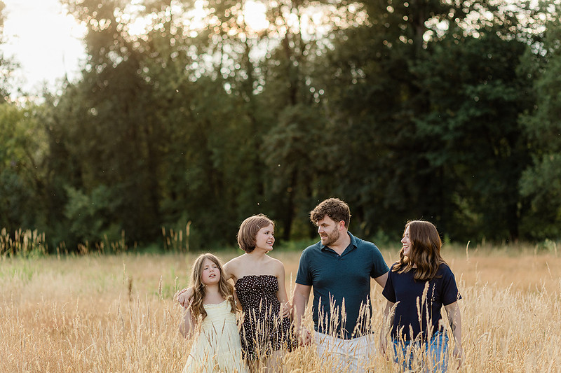 Portrait of a Family of 4 standing in a field at Daybreak Park in Battleground WA
