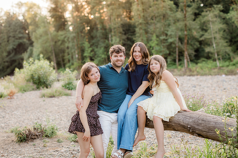 Portrait of a Family of 4 standing in a field at Daybreak Park in Battleground WA