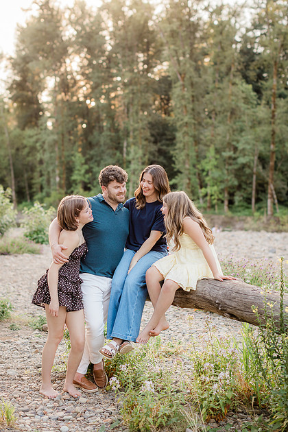 Portrait of a Family of 4 standing in a field at Daybreak Park in Battleground WA