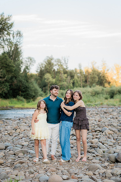 Portrait of a Family of 4 standing in a field at Daybreak Park in Battleground WA