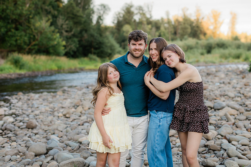 Portrait of a Family of 4 standing in a field at Daybreak Park in Battleground WA