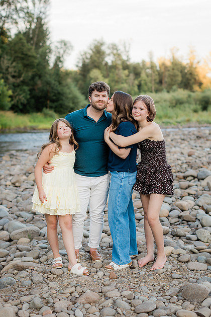 Portrait of a Family of 4 standing in a field at Daybreak Park in Battleground WA