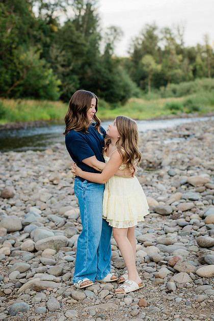 Portrait of a Family of 4 standing in a field at Daybreak Park in Battleground WA