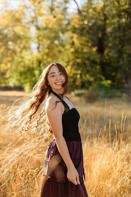 Girl senior athlete on a basketball court and by the river